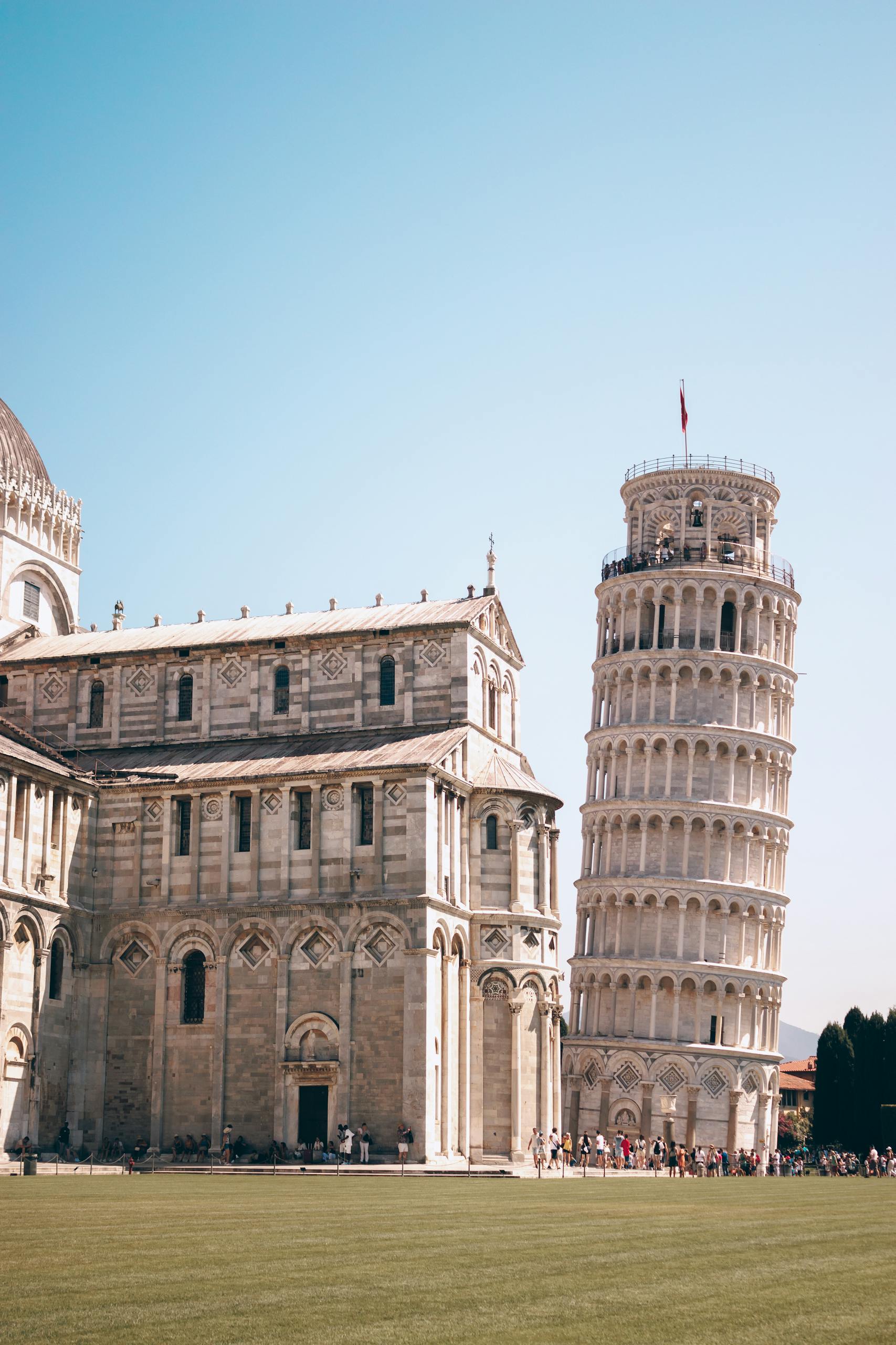 The iconic Leaning Tower of Pisa on a sunny day in the Piazza dei Miracoli, Italy.